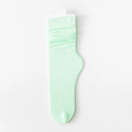Mint green slouch socks featuring a vertical ribbed knit texture and stylish folded cuffs - One Size / Mint Green
