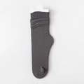 Dark grey slouch socks in rib-knit texture with minimalist white card packaging - One Size / Dark Gray
