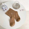 Brown ribbed knit mid-calf cotton socks in minimalist Japanese aesthetic flat lay - One Size / Khaki