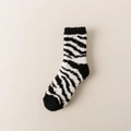 Zebra striped coral fleece thermal socks in black and white with soft plush texture - One Size / Zebra Print