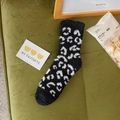 Thick coral fleece socks in black and white leopard print for winter warmth - One Size / Black