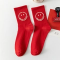 Red cotton crew socks featuring a white fuzzy smiling face embroidery and ribbed cuffs - One Size / Smiley Face
