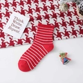 Classic red and white striped crew socks with ribbed cuffs for festive holiday comfort - One Size / Red Stripe