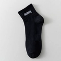 Men's black cotton blend short socks featuring white Freedom text and ribbed cuffs - Black