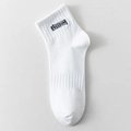 White cotton sport socks featuring black Freedom embroidery and ribbed elastic texture - White