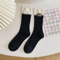 Chaussettes contrastées noir et blanc avec bords côtelés et étiquette cœur - Taille unique / Noir