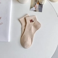 Minimalist cream knit ankle socks with brown H letter embroidery in a cozy setting - One Size / Khaki