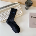 Black ribbed mid-tube socks featuring a blue dog embroidery and Deus character details - One Size / Puppy Black