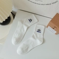 White crew socks featuring mountain embroidery and DREAM lettering in cotton fabric - One Size / White
