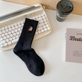 Women's black ribbed knit crew socks featuring a colorful toucan bird embroidery - One Size / Bird Black