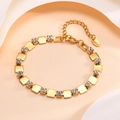 Macro shot of 18K gold plated heart bracelet showing K18 stamp and zircon settings - Square Style (04)
