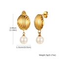 Macro view of gold shell earrings with pearl detail showing 2.95cm height measurements - Gold