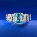 Elegant S925 silver ring with emerald cut light blue gemstone and geometric diamond accents - Aquamarine / US 5