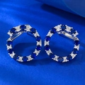 Macro shot of S925 silver stud earrings with blue and white sapphire pavé circular design - 925 Silver / Blue Rhinestone (E506)