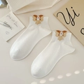 White crew socks with 3D brown plush bow and lace detail in elegant soft lighting - One Size / Yellow