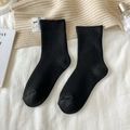 Solid black mid-calf cotton socks with vertical ribbed texture and elastic cuffs - One Size / Black