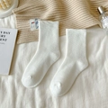 Thick white crew socks for women with ribbed cuffs and cozy thermal cotton texture - One Size / White