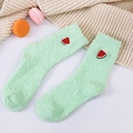 Close-up of soft coral fleece socks in light green with cute watermelon embroidery detail - One Size / Light Green (Watermelon Embroidery)