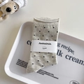 Light gray polka dot crew socks with ribbed cuffs and minimalist paper wrap packaging - One Size / Grey-Beige