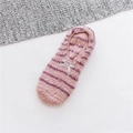 Detailed view of pink striped plush slipper socks with bow and non-slip silicone bottom - One Size / Pink Stripe