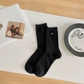 Classic black ribbed crew socks with a subtle silver star ornament on the cuff - Black Small Plaid