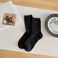 Minimalist black crew socks with ribbed texture and silver ring detail for women - Black Four-leaf Clover