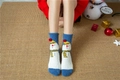 Detailed view of plush coral fleece snowman socks with 3D red pom-poms for Christmas - Blue White Snowman (No. 1)