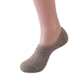 Detail of warm light brown fleece slippers socks with plush texture on a model's foot - Size 37-40 / Khaki