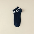 Dark blue low-cut ribbed boat socks for men with white stripes on a beige leather background - One Size / Navy Blue