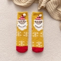 Thick warm yellow coral fleece Christmas socks featuring a Santa Claus pattern and pompom - One Size / Turmeric