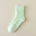 Soft light green fuzzy slipper socks with white anti-slip grips on the bottom - One Size / Light Green