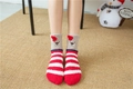 Close-up of fluffy Christmas socks with bear face embroidery and festive red stripes - Red White Striped Bear with Hat (No. 7)