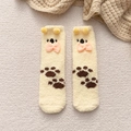 Cute light yellow coral fleece socks featuring plush balls, bows, and animal paw prints - One Size / Light Yellow