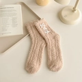 Soft apricot coral fleece socks with white bows in a cozy indoor setting - One Size / Dark Khaki