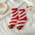 Red and white striped coral fleece warm socks with brown toe detail in home setting - Burgundy Stripes