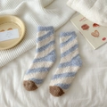 Blue and white striped coral fleece socks with brown toe in a cozy home setting - Blue Stripe
