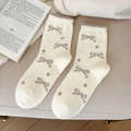 Calze calde spesse color crema con fiocco marrone e pois in materiale felpato - Bianco