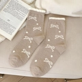 Calze termiche marrone moka con fiocchi bianchi e pois per l'inverno in casa comode - Cachi