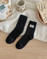 Thick black coral fleece socks with cute bear patch and soft fluffy texture for winter - One Size / Black