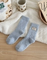 Thick light blue coral fleece socks with cute bear patch and soft plush texture - One Size / Blue