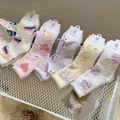 Five pack of thick coral fleece mid-calf socks with cute pastel rainbow and star patterns - One Size / Assorted Colors