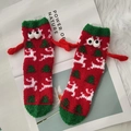 Christmas coral fleece socks with 3D eyes and tiny hands on white plush background - Reindeer - Red Small Hands
