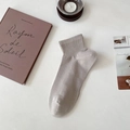Men's light grey mesh athletic socks with ribbed cuffs on a minimalist desk setup - One Size / Khaki