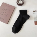 Classic black cotton sports crew sock with ribbed cuff on a minimalist aesthetic background - One Size / Black