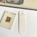 Minimalist creamy white modal slouch socks with ribbed texture and paper hangtag - One Size / Cream