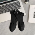 Black cotton sport socks featuring white G letter embroidery with a ribbed cuff design - One Size / Black