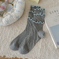 Gray slouch socks featuring light blue ruffle edges and delicate bow embroidery detail - One Size / Gray