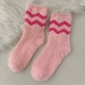 Soft pink coral fleece socks featuring dark pink zigzag patterns for winter home wear - One Size / Wave Style