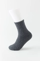 Dark gray coral fleece crew socks in solid color with thick plush texture on leg model - Black