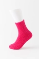 Fuzzy coral fleece socks in rose pink color displayed on a white foot model - Rose Red